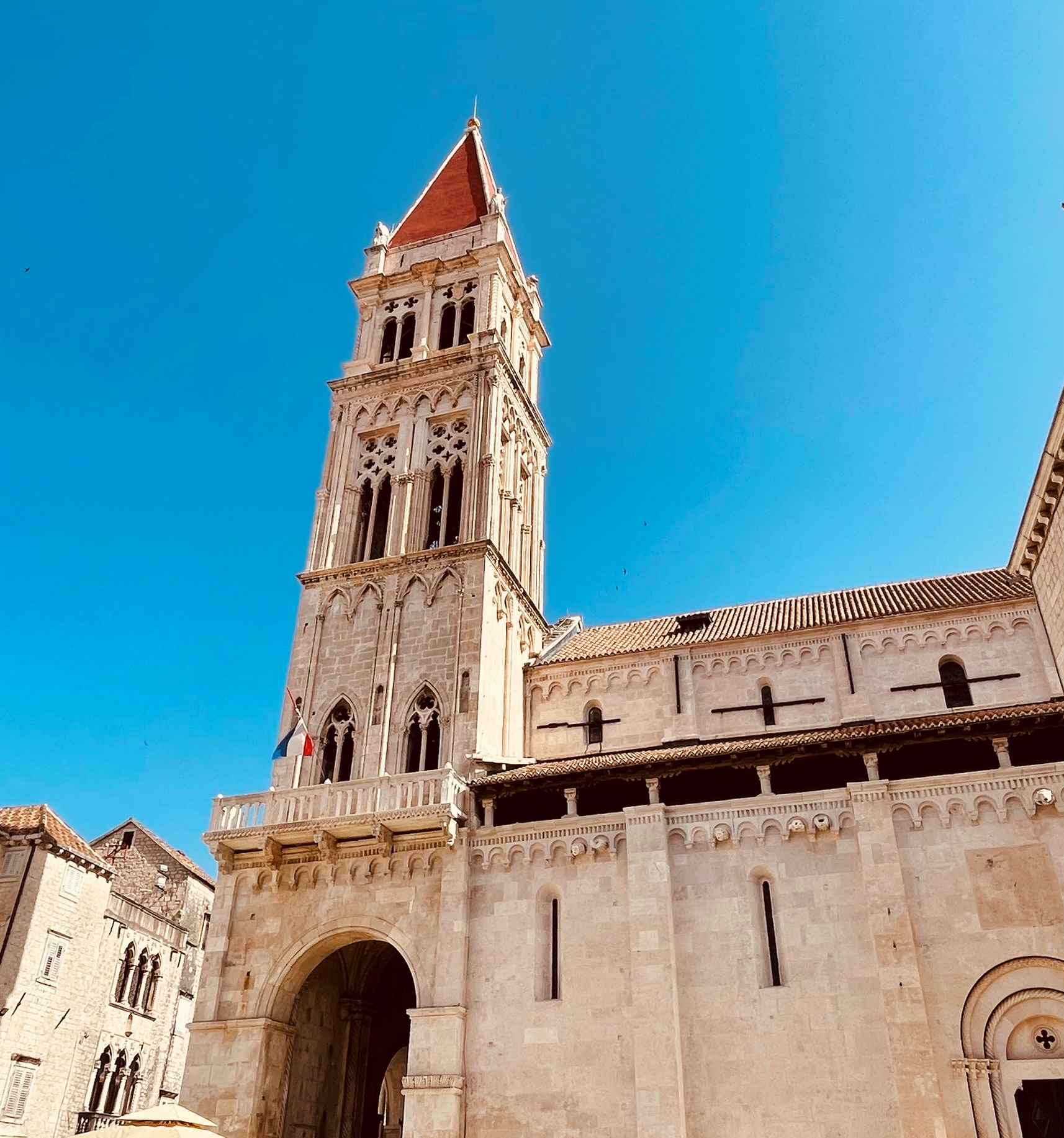 Bell Tower in Trogir, Croatia against blue sky